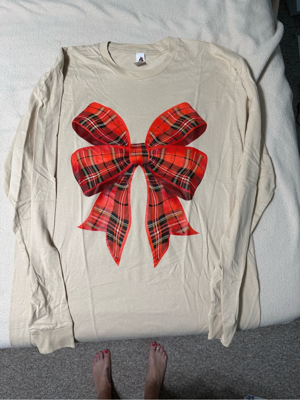 Cream Long-Sleeve Tee with Red Plaid Bow Graphic